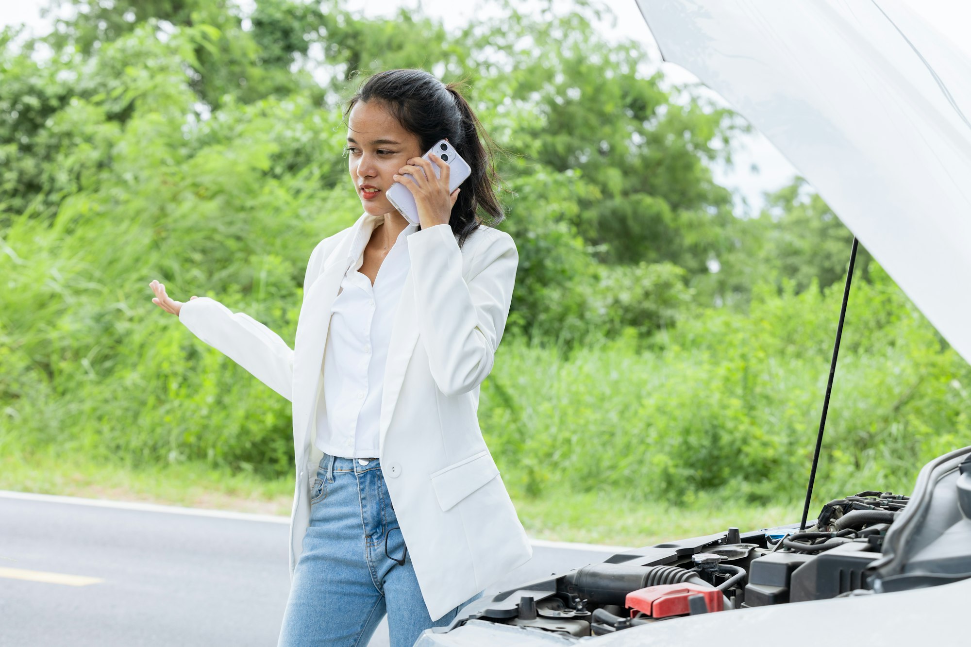 oman calling help and insurance auto service with a problem broken car on the road, angry upset